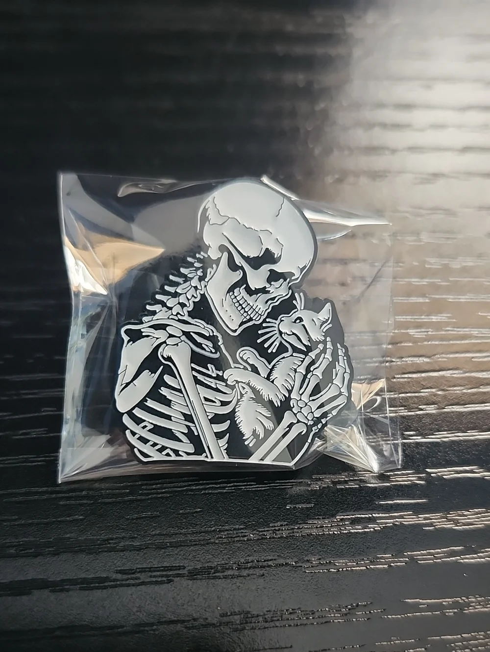 Black & White Skeleton Holding Cat Enamel Pin